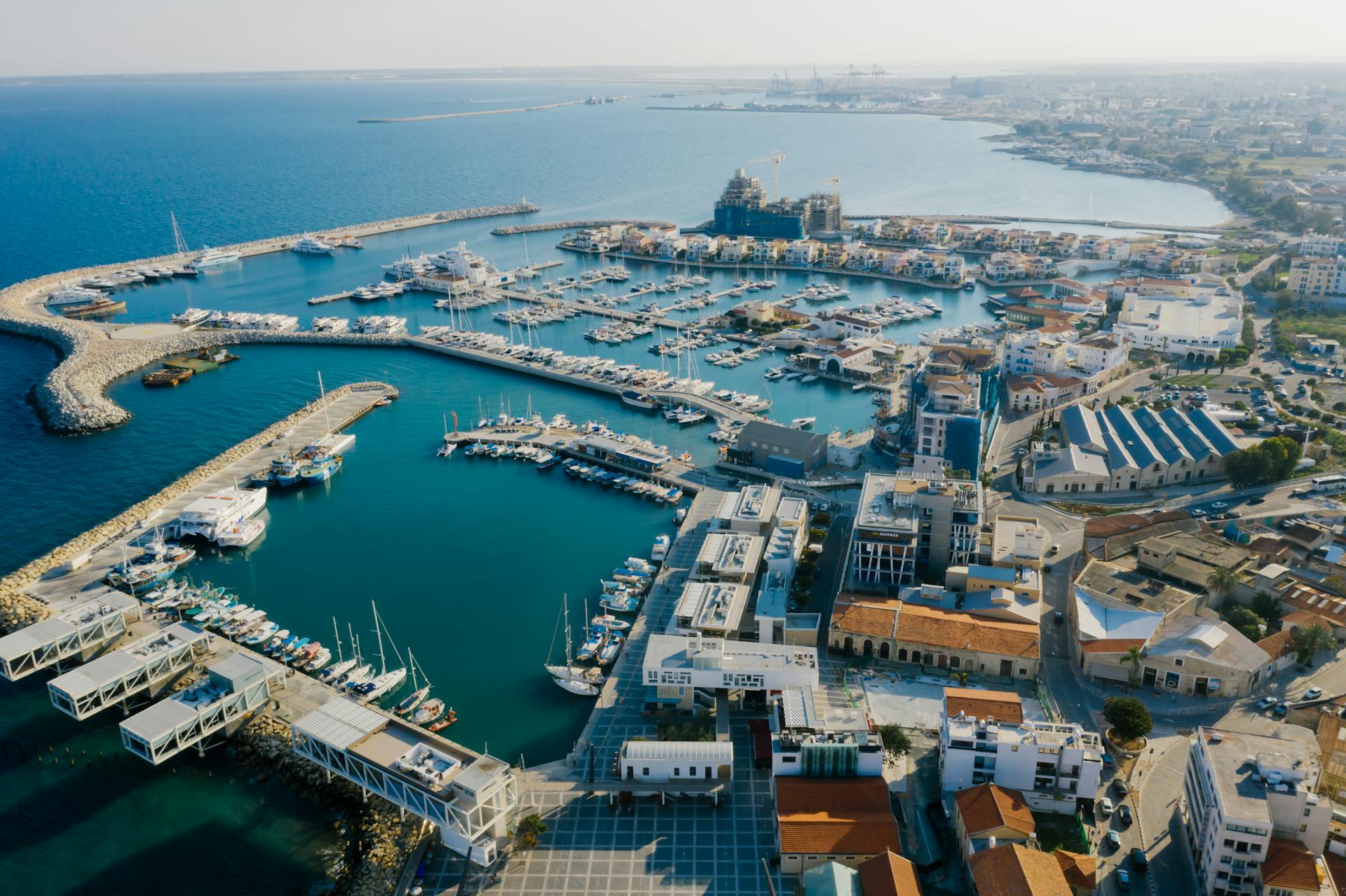 a city with boats and a body of water - Cyprus