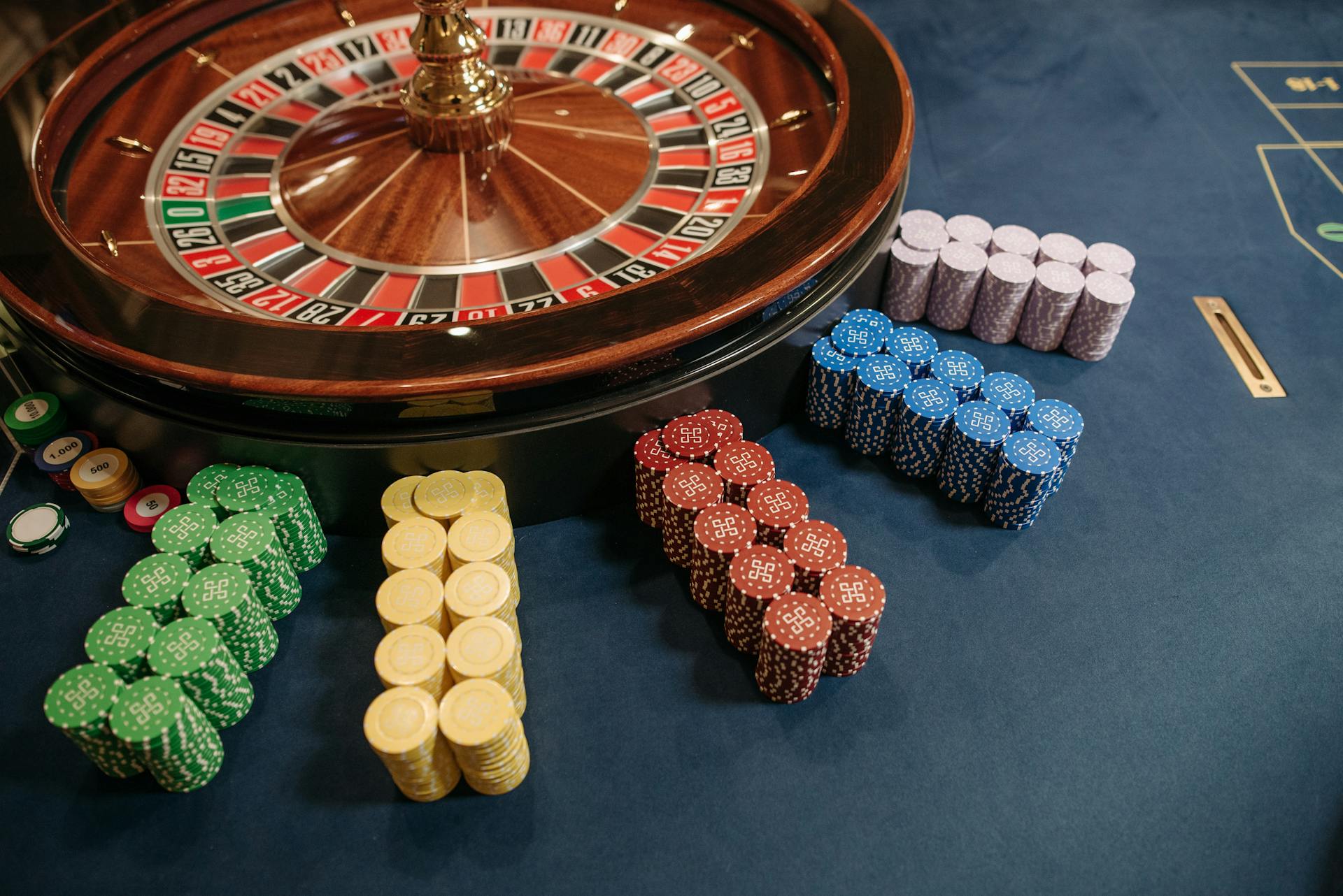 a roulette wheel with stacks of poker chips - Monaco Casino